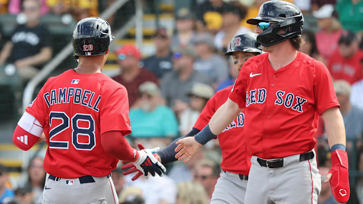  Boston Red Sox left fielder Kristian Campbell, second base Nick Sogard (20) and center fielder Trayce Thompson (37) score runs during the second inning against the Pittsburgh Pirates at LECOM Park.