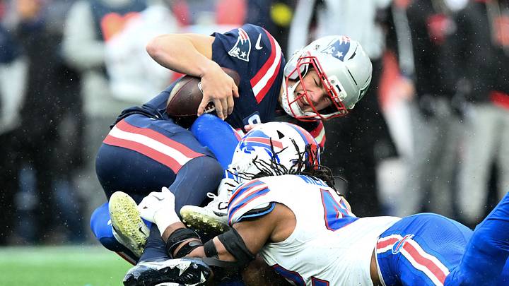 Dec. 14, 2025; Foxborough, Massachusetts, USA; New England Patriots' quarterback Drake Maye (10) is taken to the ground by Buffalo Bills' linebacker Dorian Williams (42) during the second half at Gillette Stadium. Dec. 14, 2025; Foxborough, Massachusetts, USA; New England Patriots' quarterback Drake Maye (10) is taken to the ground by Buffalo Bills' linebacker Dorian Williams (42) during the second half at Gillette Stadium.