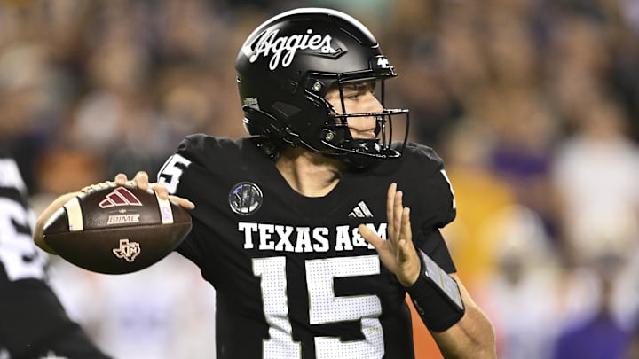 Oct 26, 2024; College Station, Texas, USA; Texas A&M Aggies quarterback Conner Weigman (15) looks to throw the ball during the third quarter against the LSU Tigers. The Aggies defeated the Tigers 38-23; at Kyle Field. Mandatory Credit: Maria Lysaker-Imagn Images. 