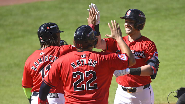 Oct 5, 2024; Cleveland, OH, USA;  Cleveland Guardians outfielder Lane Thomas (8) celebrates with Guardians first baseman Josh Naylor (22) and Guardians third baseman Jose Ramirez (11) after hitting a three-run home run against the Detroit Tigers in the first inning in game one of the ALDS for the 2024 MLB Playoffs at Progressive Field.