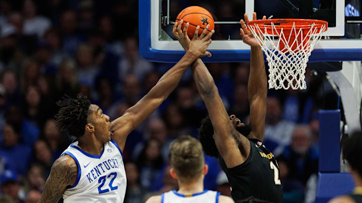 Feb 19, 2025; Lexington, Kentucky, USA; Kentucky Wildcats center Amari Williams (22) blocks a shot by Vanderbilt Commodores forward Jaylen Carey (22) during the second half at Rupp Arena at Central Bank Center. Mandatory Credit: Jordan Prather-Imagn Images