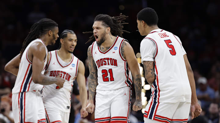 Mar 21, 2026; Oklahoma City, OK, USA; Houston Cougars guard Emanuel Sharp (21) reacts after a made basket during the first half against the Texas A&M Aggies in a second round game of the men's 2026 NCAA Tournament at Paycom Center. Mandatory Credit: Alonzo Adams-Imagn Images