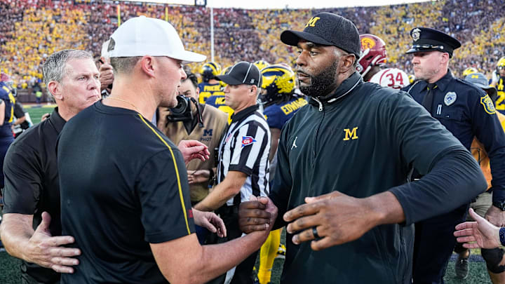 Michigan head coach Sherrone Moore shakes hands with USC head coach Lincoln Riley after 27-24 win at Michigan Stadium in Ann Arbor on Saturday, Sept. 21, 2024.