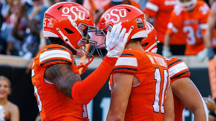 Oklahoma State Cowboys wide receiver Kam Powell celebrates with wide receiver Wyatt Young. Oklahoma State Cowboys wide receiver Kam Powell celebrates with wide receiver Wyatt Young.