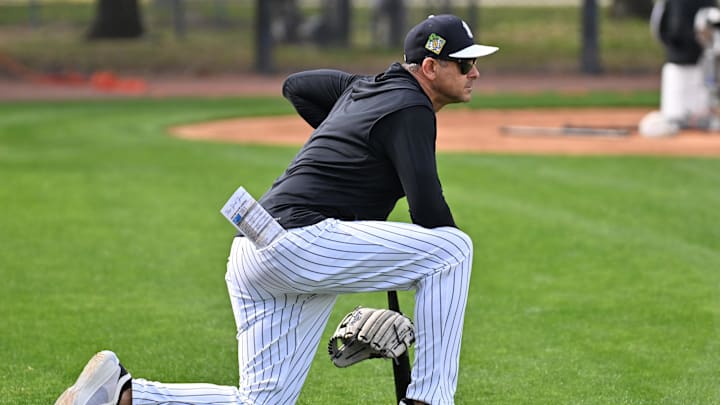 Feb 16, 2026; Tampa, FL, USA; New York Yankees manager Aaron Boone (17) watches players workout during spring training at George M. Steinbrenner Field. Mandatory Credit: Jonathan Dyer-Imagn Images