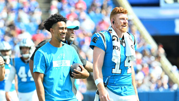 Aug 24, 2024; Orchard Park, New York, USA; Carolina Panthers quarterback Bryce Young and quarterback Andy Dalton (14) react to their team scoring a touchdown against the Buffalo Bills in the third quarter pre-season game at Highmark Stadium. Mandatory Credit: Mark Konezny-Imagn Images