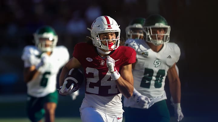 Sep 7, 2024; Stanford, California, USA; Stanford Cardinal wide receiver Tiger Bachmeier (24) returns a punt for a touchdown against the Cal Poly Mustangs during the second half at Stanford Stadium. Mandatory Credit: Sergio Estrada-Imagn Images