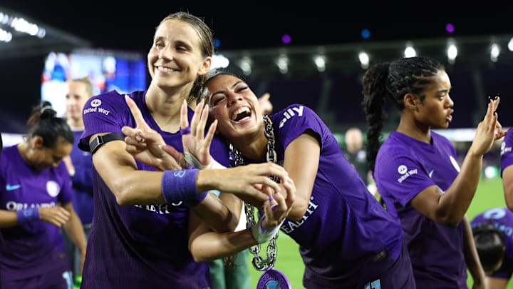 Orlando Pride defender Kylie Strom (3) and forward Ally Watt (11) celebrate after the match against Seattle Reign FC  at Inter&Co Stadium 