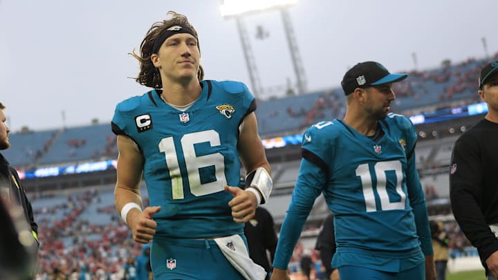Jacksonville Jaguars quarterback Trevor Lawrence (16) runs off the field after the game of an NFL
