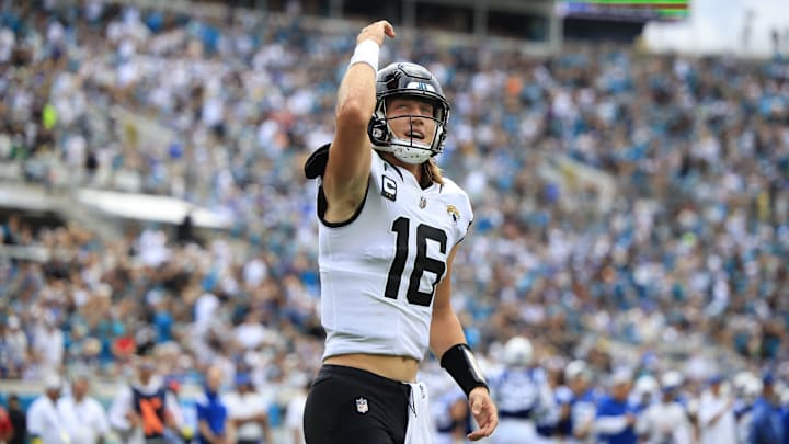 Jacksonville Jaguars quarterback Trevor Lawrence (16) pumps up the crowd after throwing a touchdown