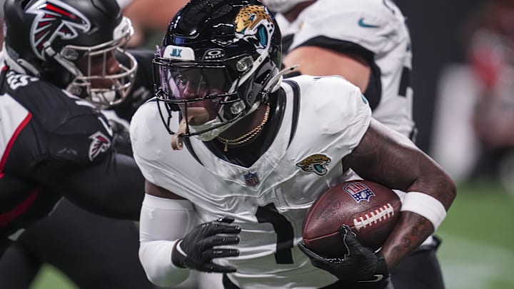 Aug 23, 2024; Atlanta, Georgia, USA; Jacksonville Jaguars running back Travis Etienne Jr. (1) runs against the Atlanta Falcons during the first half at Mercedes-Benz Stadium. Mandatory Credit: Dale Zanine-USA TODAY Sports