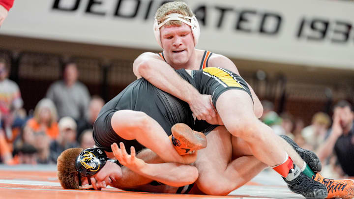 Oklahoma State’s Dustin Plott works for a take down against Missouri’s Aeoden Sinclair during an NCAA wrestling meet between Oklahoma State and Missouri at Gallagher-Iba Arena in Stillwater, Okla., on Sunday, Feb. 2, 2025.