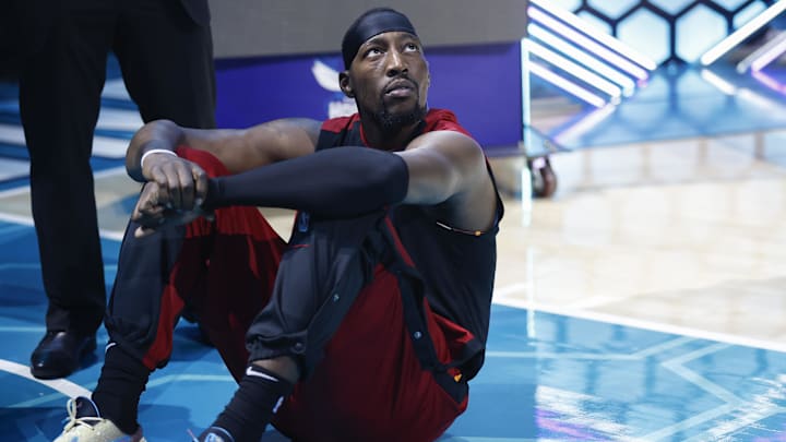 Oct 26, 2024; Charlotte, North Carolina, USA; Miami Heat center Bam Adebayo (13) sits on the floor before a game against the Charlotte Hornets at Spectrum Center. Mandatory Credit: Nell Redmond-Imagn Images