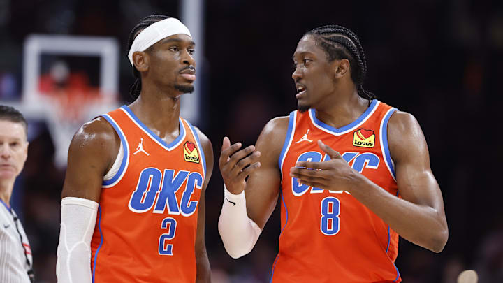 Nov 10, 2024; Oklahoma City, Oklahoma, USA; Oklahoma City Thunder guard Shai Gilgeous-Alexander (2) and forward Jalen Williams (8) talk during a time out against the Golden State Warriors during the second half at Paycom Center. Mandatory Credit: Alonzo Adams-Imagn Images