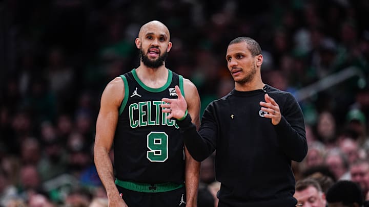 Mar 1, 2024; Boston, Massachusetts, USA; Boston Celtics head coach Joe Mazzulla talks with guard Derrick White (9) from the sideline as they take on the Dallas Mavericks at TD Garden. Mandatory Credit: David Butler II-USA TODAY Sports
