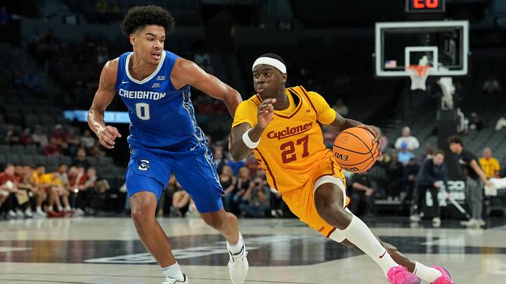 Nov 25, 2025; Las Vegas, Nevada, USA; Iowa State Cyclones guard Killyan Toure (27) drives to the basket defended by Creighton Bluejays forward Jasen Green (0) during the first half in a 2025 Players Era Festival group play game at Michelob Ultra Arena.