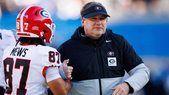Nov 19, 2022; Lexington, Kentucky, USA; Georgia Bulldogs head coach Kirby Smart hugs wide receiver Mekhi Mews (87) before the game against the Kentucky Wildcats at Kroger Field. Mandatory Credit: Jordan Prather-Imagn Images