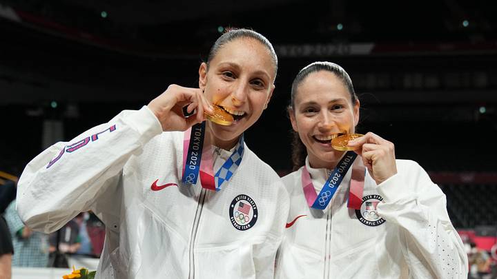 Aug 8, 2021; Saitama, Japan; United States players Diana Taurasi and Sue Bird celebrate with their gold medals after the women's basketball gold medal match during the Tokyo 2020 Olympic Summer Games at Saitama Super Arena. Mandatory Credit: Kyle Terada-Imagn Images