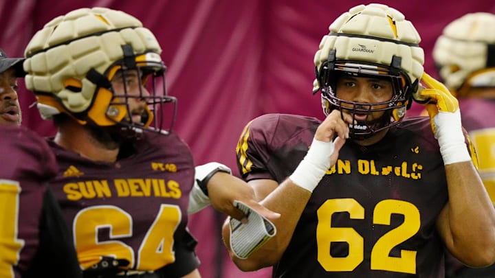 Arizona State offensive linemen Wade Helton (64) and Ben Coleman (62) run a drill during a practice inside the Verde Dickey Dome in Tempe on August 12, 2025.