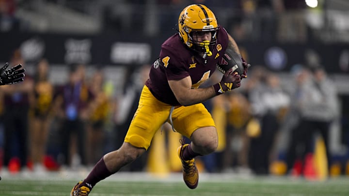 Dec 7, 2024; Arlington, TX, USA; Arizona State Sun Devils running back Cam Skattebo (4) in action during the game between the Iowa State Cyclones and the Arizona State Sun Devils at AT&T Stadium. 