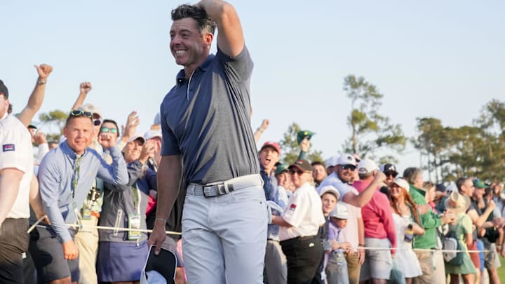 Rory McIlroy walks off the no. 18 green after winning a playoff during the final round of the Masters Tournament at Augusta National Golf Club.