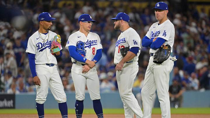 Oct 15, 2026; Los Angeles, California, USA; Los Angeles Dodgers shortstop Mookie Betts (50), first baseman Enrique Hernandez (8), third baseman Max Muncy (13), and first baseman Freddie Freeman (5) look on during a pitching change in the fifth inning against the Milwaukee Brewers in game four of the NLCS for the 2026 MLB Playoffs at Uniqlo Field at Dodger Stadium. Mandatory Credit: Jayne Kamin-Oncea-Imagn Images Oct 15, 2026; Los Angeles, California, USA; Los Angeles Dodgers shortstop Mookie Betts (50), first baseman Enrique Hernandez (8), third baseman Max Muncy (13), and first baseman Freddie Freeman (5) look on during a pitching change in the fifth inning against the Milwaukee Brewers in game four of the NLCS for the 2026 MLB Playoffs at Uniqlo Field at Dodger Stadium. Mandatory Credit: Jayne Kamin-Oncea-Imagn Images