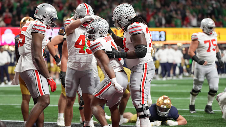 Jan 20, 2025; Atlanta, GA, USA; Ohio State Buckeyes running back Quinshon Judkins (1) celebrates with teammates after scoring a touchdown against the Notre Dame Fighting Irish in the second half in the CFP National Championship college football game at Mercedes-Benz Stadium. Mandatory Credit: Dale Zanine-Imagn Images