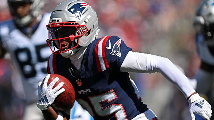 Sep 28, 2025; Foxborough, Massachusetts, USA; New England Patriots cornerback Marcus Jones (25) returns a punt for a touchdown against the Carolina Panthers during the first half at Gillette Stadium.