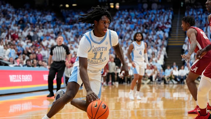 Dec 4, 2024; Chapel Hill, North Carolina, USA;  North Carolina Tar Heels guard Ian Jackson (11) with the ball in the second half at Dean E. Smith Center. Mandatory Credit: Bob Donnan-Imagn Images