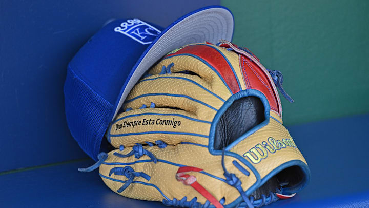 Aug 12, 2023; Kansas City, Missouri, USA;  Detailed view of a Kansas City Royals hat and glove before a game  against the St. Louis Cardinals at Kauffman Stadium. Mandatory Credit: Peter Aiken-Imagn Images