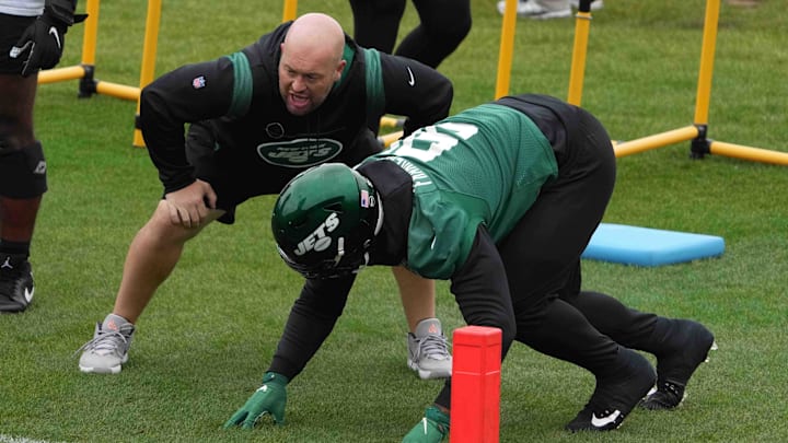 Oct 8, 2021; Ware, England, United Kingdom; New York Jets defensive line coach Aaron Whitecotton and defensive end John Franklin-Myers (91) during a practice at the Manor Marriott Hotel and Country Club. Mandatory Credit: Kirby Lee-Imagn Images