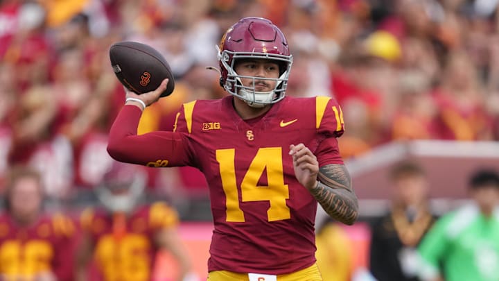 Nov 30, 2024; Los Angeles, California, USA; Southern California Trojans quarterback Jayden Maiava (14) throws the ball against the Notre Dame Fighting Irish in the first half at United Airlines Field at Los Angeles Memorial Coliseum. Mandatory Credit: Kirby Lee-Imagn Images