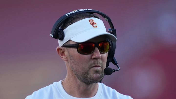 Oct 21, 2023; Los Angeles, California, USA; Southern California Trojans head coach Lincoln Riley watches from the sidelines against the Utah Utes in the first half at United Airlines Field at Los Angeles Memorial Coliseum. Mandatory Credit: Kirby Lee-Imagn Images