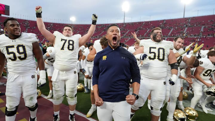 Nov 30, 2024; Los Angeles, California, USA; Notre Dame Fighting Irish head coach Marcus Freeman celebrates with players at the end of the game against the Southern California Trojans at United Airlines Field at Los Angeles Memorial Coliseum. Nov 30, 2024; Los Angeles, California, USA; Notre Dame Fighting Irish head coach Marcus Freeman celebrates with players at the end of the game against the Southern California Trojans at United Airlines Field at Los Angeles Memorial Coliseum.