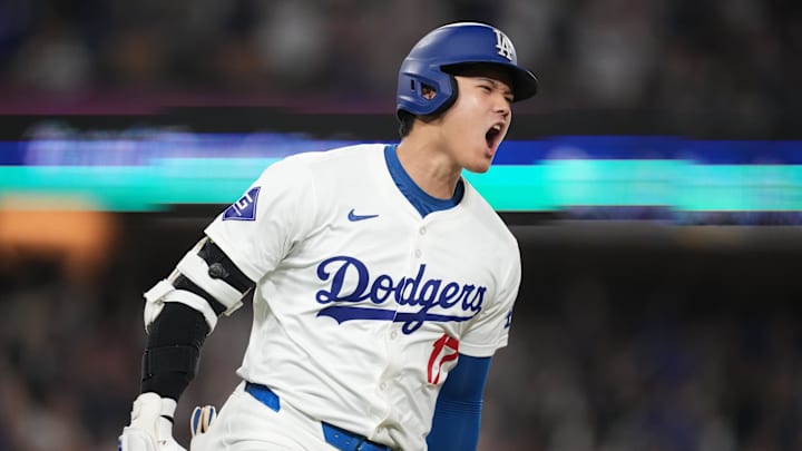 Sep 25, 2024; Los Angeles, California, USA; Los Angeles Dodgers designated hitter Shohei Ohtani (17) celebrates after hitting a single in the sixth inning against the San Diego Padres at Dodger Stadium. Mandatory Credit: Kirby Lee-Imagn Images