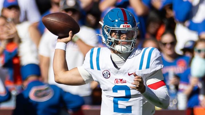 Nov 23, 2024; Gainesville, Florida, USA; Mississippi Rebels quarterback Jaxson Dart (2) throws the ball against the Florida Gators during the first half at Ben Hill Griffin Stadium. Mandatory Credit: Matt Pendleton-Imagn Images