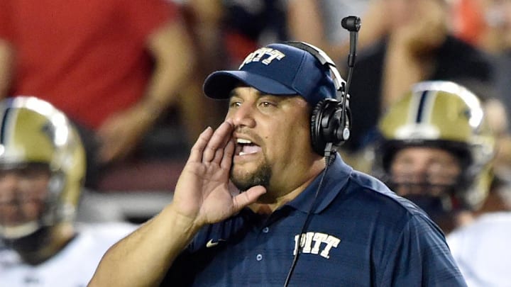 Sep 5, 2014; Boston, MA, USA; Pittsburgh Panthers defensive tackles coach Inoke Breckterfield directs players on the field against the Boston College Eagles during the first half at Alumni Stadium. Pitt won 30-20 over Boston College. Mandatory Credit: Gregory J. Fisher-Imagn Images