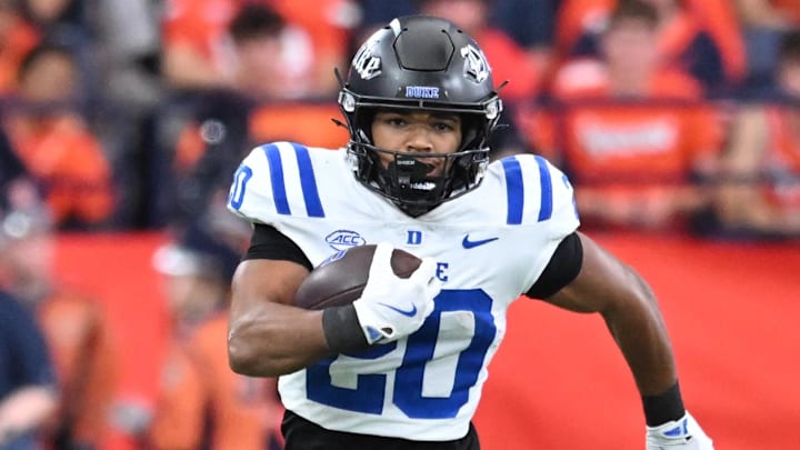 Sep 27, 2025; Syracuse, New York, USA; Duke Blue Devils running back Nate Sheppard (20) carries the ball in the second quarter against the Syracuse Orange at the JMA Wireless Dome. Mandatory Credit: Mark Konezny-Imagn Images
