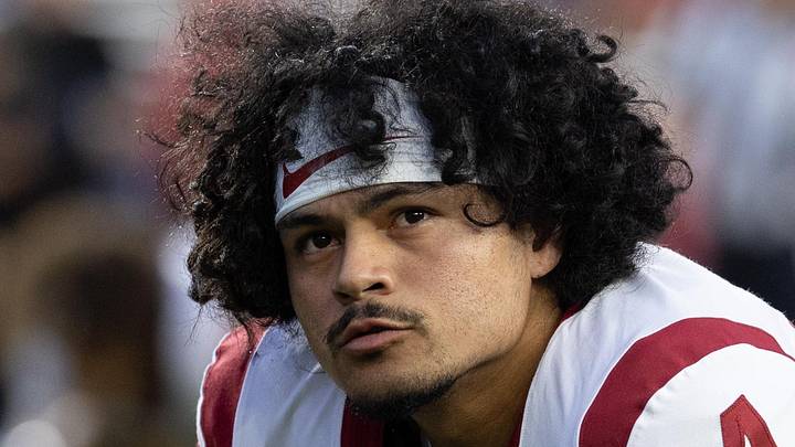 Oct 24, 2026; Madison, Wisconsin, USA; USC Trojans quarterback Jayden Maiava (14) stretches during warmups before the game against the Wisconsin Badgers at Camp Randall Stadium. Mandatory Credit: Anthony Wahl-Imagn Images Oct 24, 2026; Madison, Wisconsin, USA; USC Trojans quarterback Jayden Maiava (14) stretches during warmups before the game against the Wisconsin Badgers at Camp Randall Stadium. Mandatory Credit: Anthony Wahl-Imagn Images