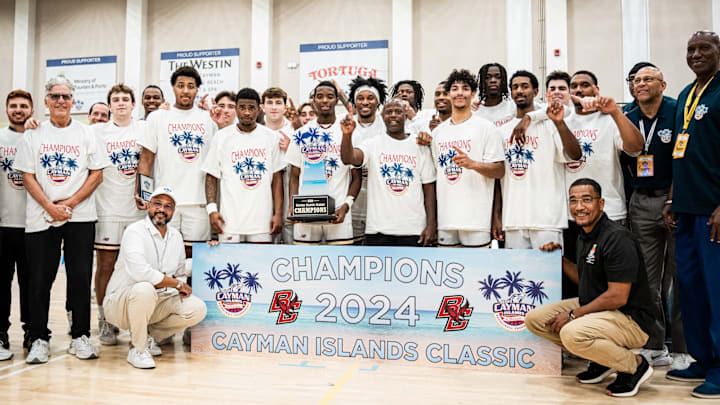 Boston College men's basketball poses with the trophy after winning the 2024 Cayman Islands Classic over Boise State, 63-61. 