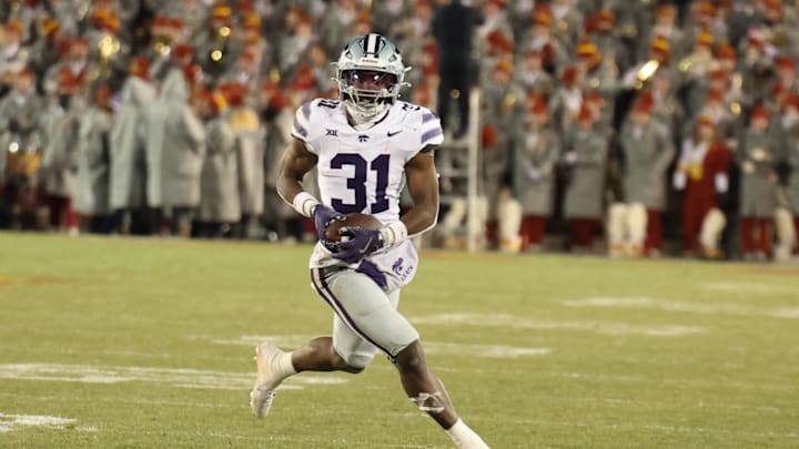 Nov 30, 2024; Ames, Iowa, USA; Kansas State Wildcats running back DJ Giddens (31) runs for a first down against the Iowa State Cyclones in the second quarter at at Jack Trice Stadium. Mandatory Credit: Reese Strickland-Imagn Images Nov 30, 2024; Ames, Iowa, USA; Kansas State Wildcats running back DJ Giddens (31) runs for a first down against the Iowa State Cyclones in the second quarter at at Jack Trice Stadium. Mandatory Credit: Reese Strickland-Imagn Images