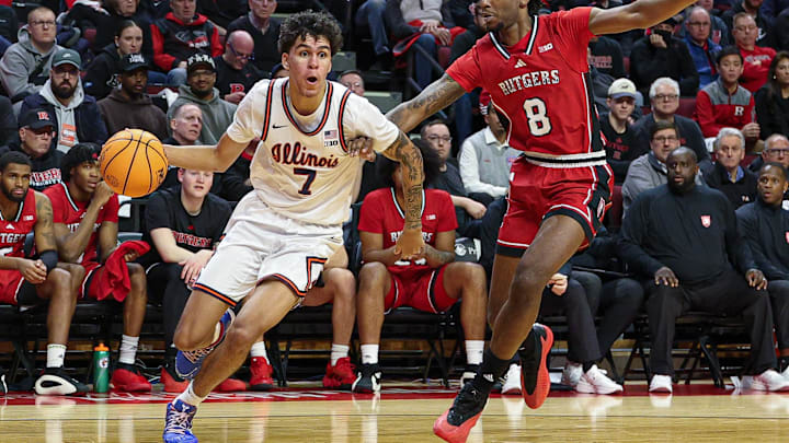 Feb 5, 2025; Piscataway, New Jersey, USA; Illinois Fighting Illini forward Will Riley (7) is defended by Rutgers Scarlet Knights forward Bryce Dortch (8) during the first half at Jersey Mike's Arena. Mandatory Credit: Vincent Carchietta-Imagn Images