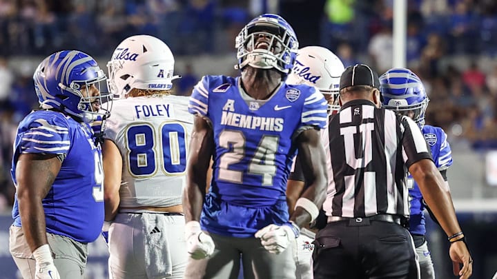 Oct 4, 2025; Memphis, Tennessee, USA; Memphis Tigers defensive back Kamari Wilson (24) reacts after a defensive stop against the Tulsa Golden Hurricane during the first half at Simmons Bank Liberty Stadium. Mandatory Credit: Wesley Hale-Imagn Images