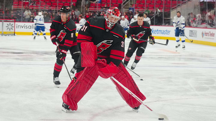 Oct 11, 2024; Raleigh, North Carolina, USA;  Carolina Hurricanes goaltender Frederik Andersen (31) skates with the puck during the warmups before the game against the Tampa Bay Lightning at PNC Arena. Mandatory Credit: James Guillory-Imagn Images