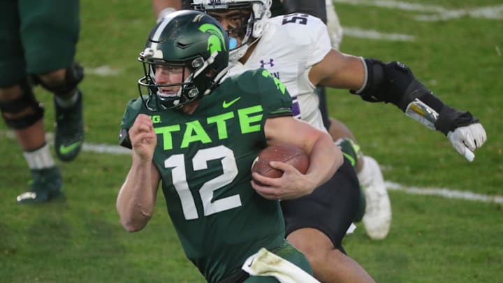 Michigan State quarterback Rocky Lombardi runs the ball against Northwestern defenders during the first half at Spartan Stadium on Saturday, Nov. 28, 2020.

Msu