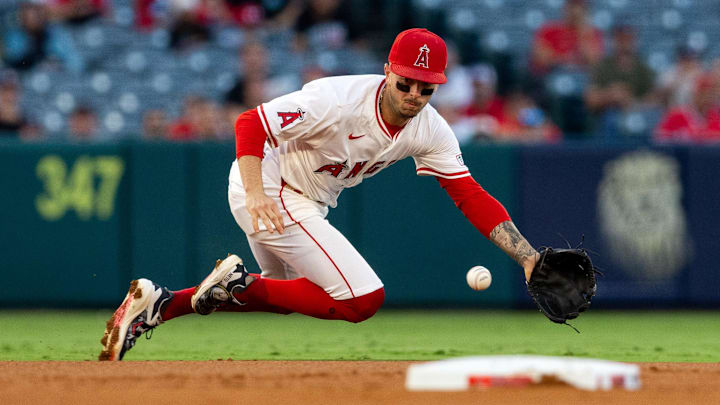 Sep 14, 2024; Anaheim, California, USA; Los Angeles Angels shortstop Zach Neto (9) fields a ground ball duirng the 1st inning against the Houston Astros at Angel Stadium. Mandatory Credit: Jason Parkhurst-Imagn Images