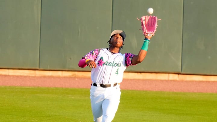 Apr 18, 2025; North Augusta, South Carolina, USA; Augusta GreenJackets Isaiah Drake (4) catches the ball during the Augusta GreenJackets and Myrtle Beach baseball game at SRP Park. The Augusta GreenJackets unveiled their new Augusta Azalea uniforms. Mandatory Credit: Katie Goodale - Augusta Chronicle/USA TODAY NETWORK