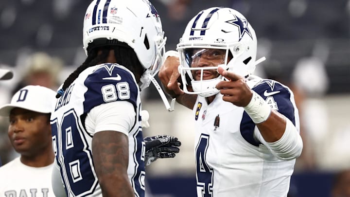 Dallas Cowboys quarterback Dak Prescott and Ceedee Lamb celebrate against the Washington Commanders at AT&T Stadium 