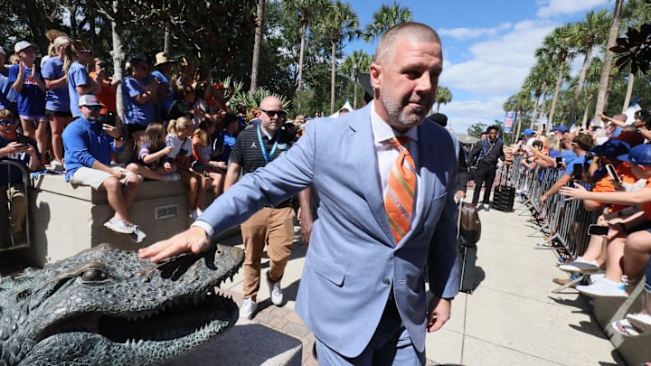 Florida head coach Billy Napier pats the gator head for good luck before an NCAA football game against Mississippi Stateat Steve Spurrier Field at Ben Hill Griffin Stadium in Gainesville, FL on Saturday, October 18, 2025. [Alan Youngblood/Gainesville Sun]