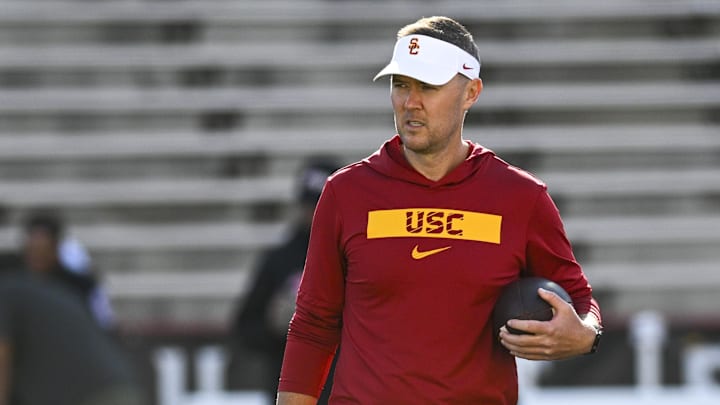 Oct 19, 2024; College Park, Maryland, USA;  Southern California Trojans head coach Lincoln Riley stands on the field before the game against the Maryland Terrapins at SECU Stadium. Mandatory Credit: Tommy Gilligan-Imagn Images